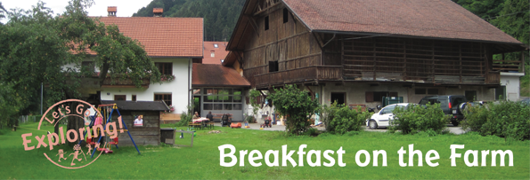 When traveling in Europe ask the locals about farms that serve meals. It is a great way to eat fresh food, discover someplace new and experience the countryside. During a trip to Tirol, Austria, we found a farm that served breakfast. There are many such farms in the Alps but this particular one was in the village of Mühlau, a district of Innsbruck, Austria. Breakfast is offered to the public on select Saturday mornings, and the locals suggested we arrive - earlier the better - as it was a very popular location. We managed to catch a ride that morning. As the car drove quickly through the narrow streets of Mühlau not many people were out. Many of the houses had yards and bright and bountiful looking gardens. Several farms were in the area, but they integrated well with the houses and with other buildings in the town. A large green space weaved its way into the town and it was hard to tell where the town ended and the farms and green space began. We arrived outside a small green yard with a sturdy looking house and several large wooden barns. Attached to the house was a newer section made of wood and glass. We entered through a heavy wooden door that swung inward, the inside building was made of a light colored wood with windows near the ceiling which allowed in an abundance of natural light. The room was clean and basic in design. A crucifix hung on one wall. Inside the room were nine or ten long tables, each with accompanying wooden benches at the sides. At these tables were maybe 80 people eating with a plate of food. The breakfast assortment included traditional items: homemade fresh bread, freshly made jam, slices of thin meat, speck, yogurt, cheese, fresh milk, some fruit, hard boiled eggs and cups of coffee. A small line of folks were standing in front of a serving table that included baskets and serving plates. The line was held up because a basket of some critical food item was out. At that moment a woman, emerged from a recessed back room, scurried over and refilled the basket of bread. Then another person, this time a child, ran over with clean mugs to refill the inventory, then another child walked over with a plate of cheeses. Then an older woman came out, this was the Mom; she straightened a few things, looked around and instructed the kids to work on some other items. The atmosphere in the dinning hall was relaxed and the people eating were content. Almost everyone there were locals. A small sign with the letters ‘wc’ (water closet) hung on a large, carved wooden door. Opening the door you walked through a storage area that included a variety of farm implements and boxes of dried food, here was an inside door that opened into the family’s house! There was a hand scrawled sign on the wall, that looked like a child hurriedly wrote it, with the letters ‘wc’ and an arrow. The arrow pointed to a small guest bathroom. I could hear a TV in one room and people talking from another room. It was an odd feeling just walking into to someone’s house. I was surprised that so many guests visited this house, yet the facilities remained very clean; it was also surprising that the family allowed strangers into where they lived. Everyone visiting the small, local farm was courteous and treated the place and each other with respect. It was a refreshing experience. When we finished our breakfast we found the farm Mom and paid for our meals. The cost was €7.50 (about $10) person. She invited us to look around outside. The big barn was inhabited by 4 large brown cows and nearby we heard chickens, but they were cooped up because of all the visitors. We looked for horses, but a sign said they were up on the mountain. The kids who were visiting the farm enjoyed petting some bunnies and guinea pigs. It was great being in the city and enjoying some good fresh and locally produced food.